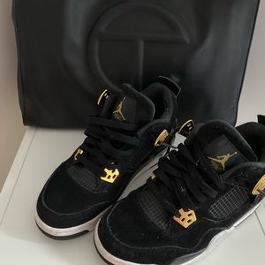 black and gold jordan 4s